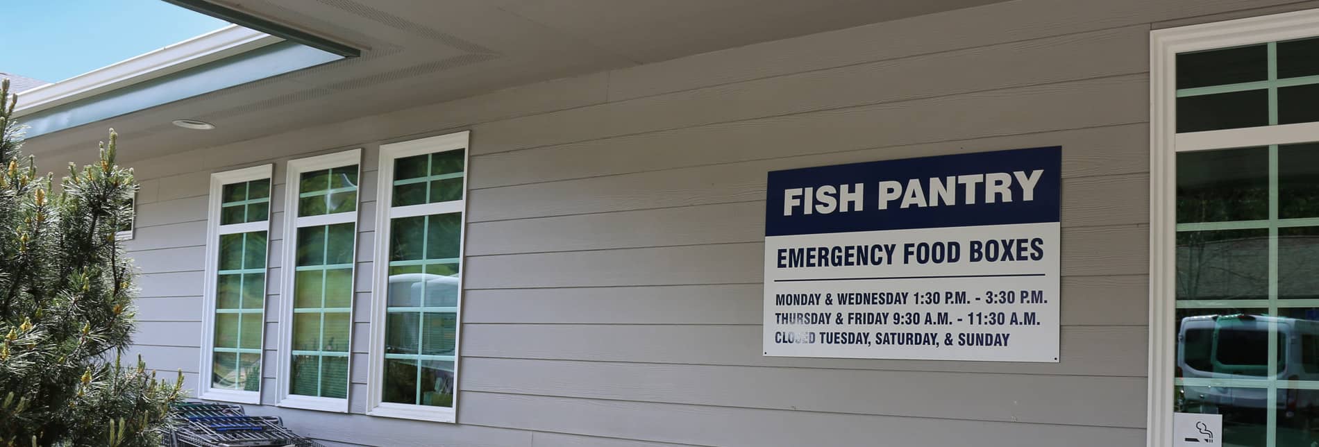 Fish Food Pantry building with posted hours